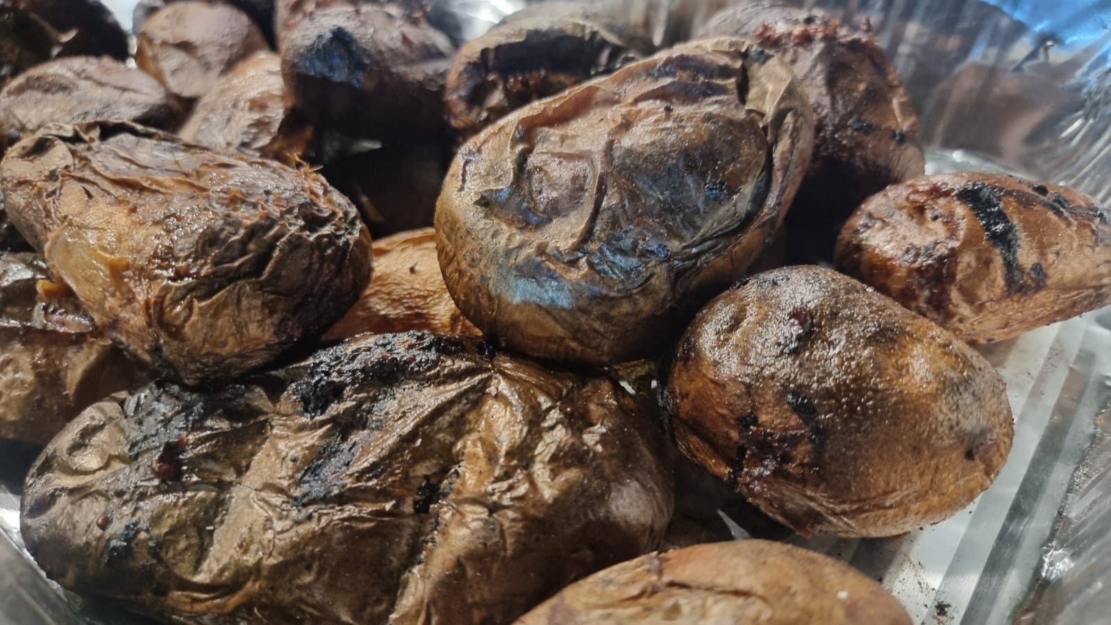 Whole potatoes roasted in the embers